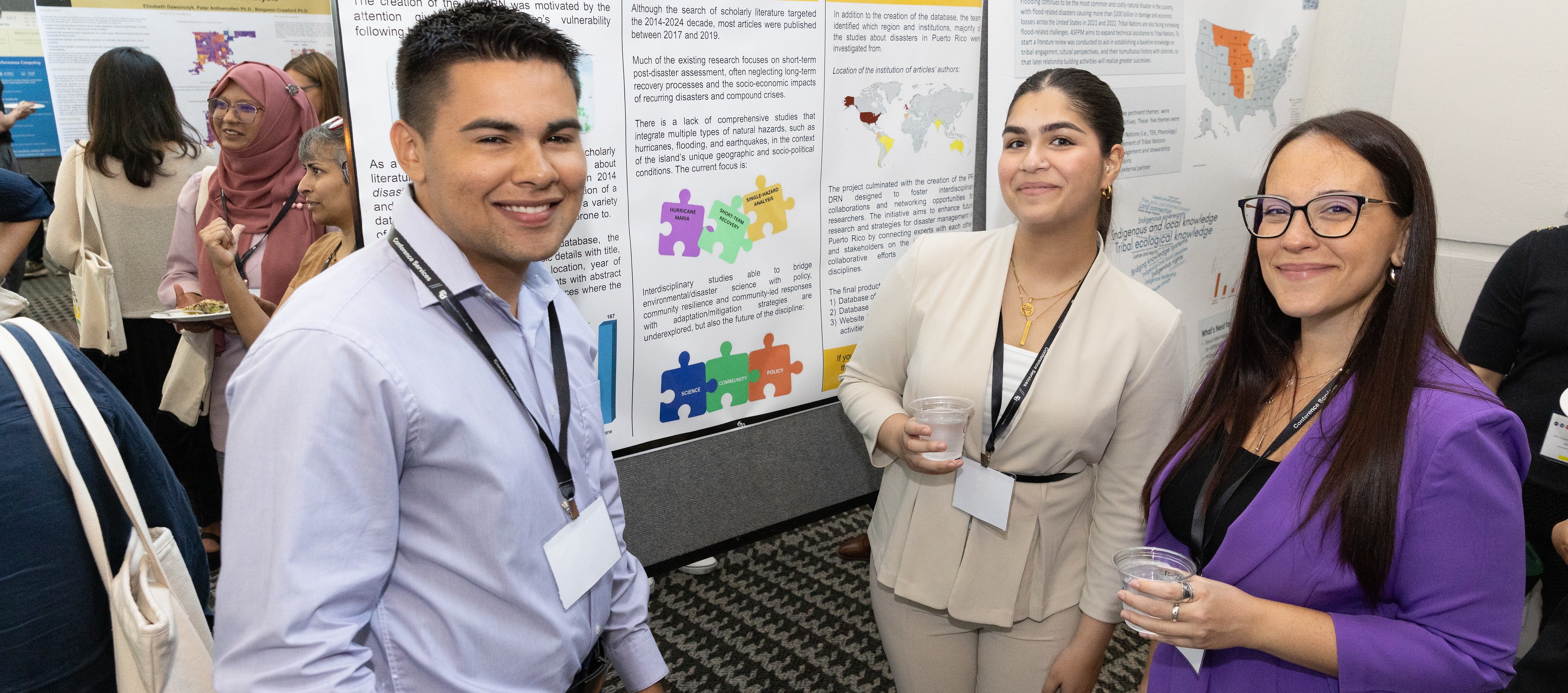 Poster presenters take a picture at the poster session