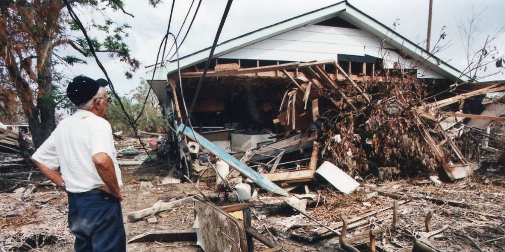 LA Sea Grant man surveys the damage