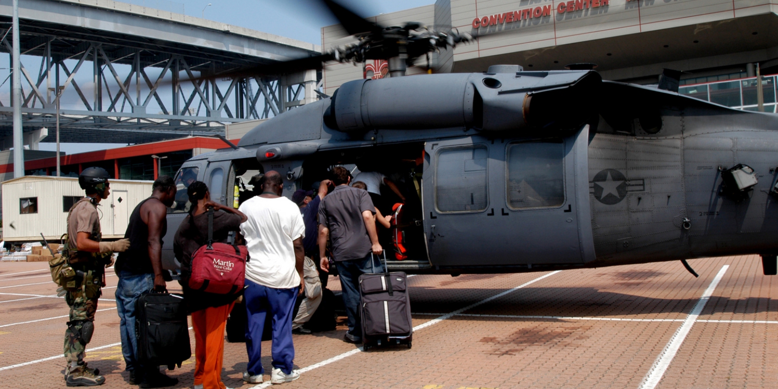 A group of evacuees at the Ernest N. Morial Convention Center being loaded onto a helicopter for transportation out of New Orleans on September 4, 2005.