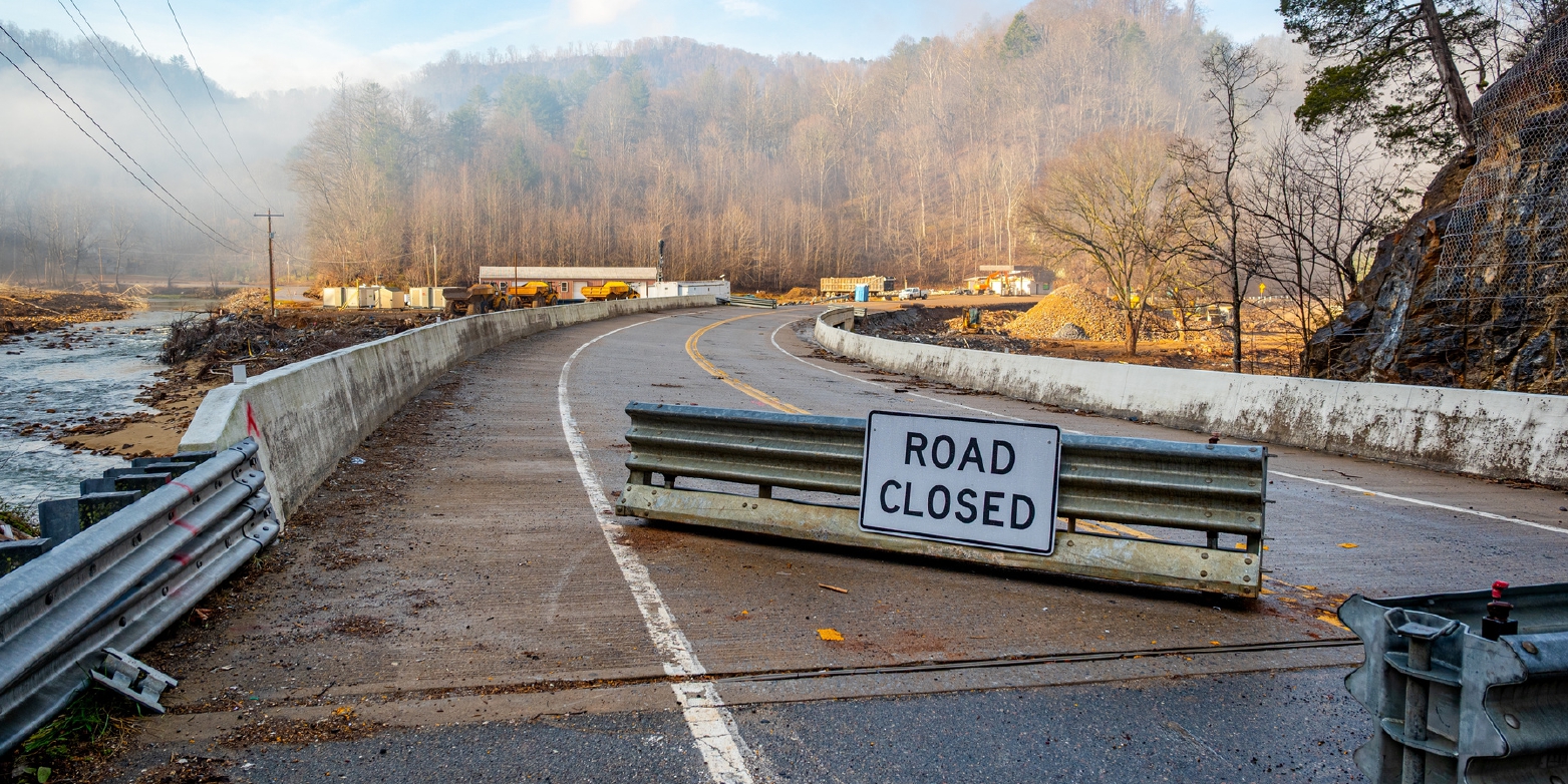 Hurricane Helene damage from Elk River flooding at closed portion of US HWY 321 Elk Mills.