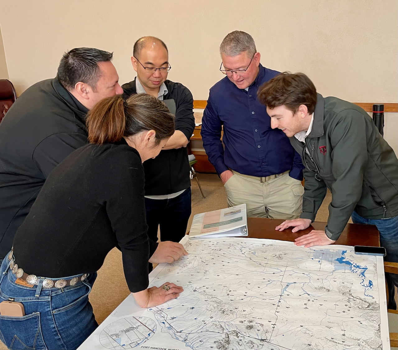 Researchers review a paper map produced for Hudspeth County, Texas, where Fort Hancock is located. Source: Institute for a Disaster Resilient Texas.
