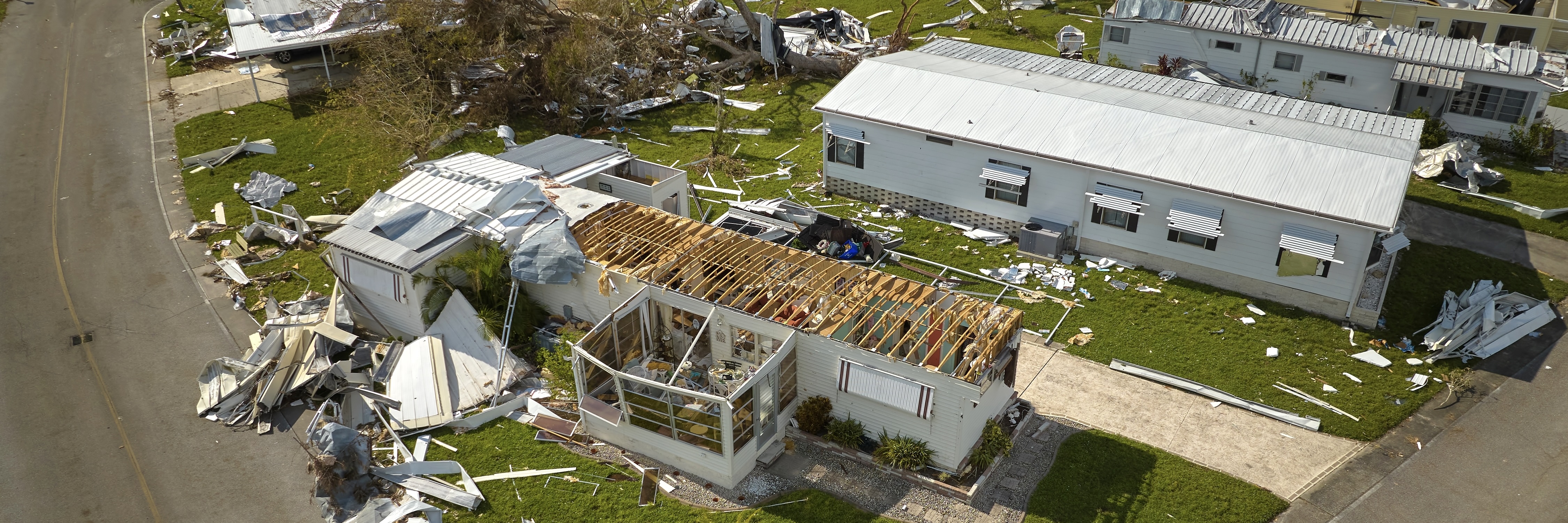A storm-damaged mobile home after a hurricane