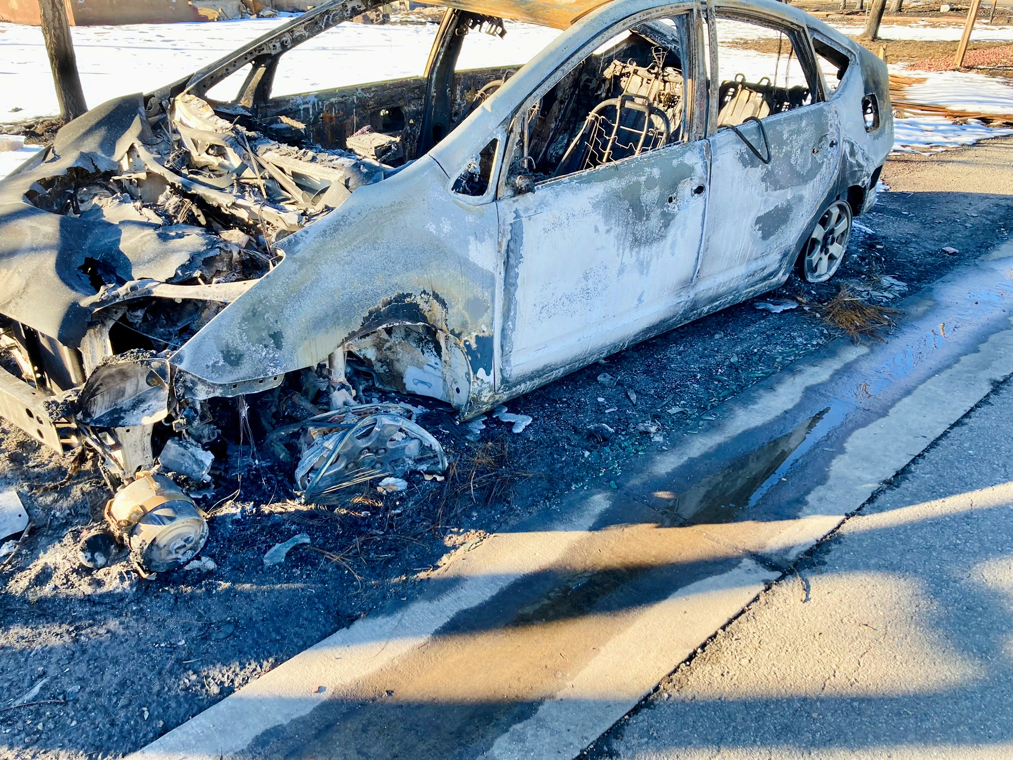 A burned vehicle in Superior, Colorado, on January 9, 2022